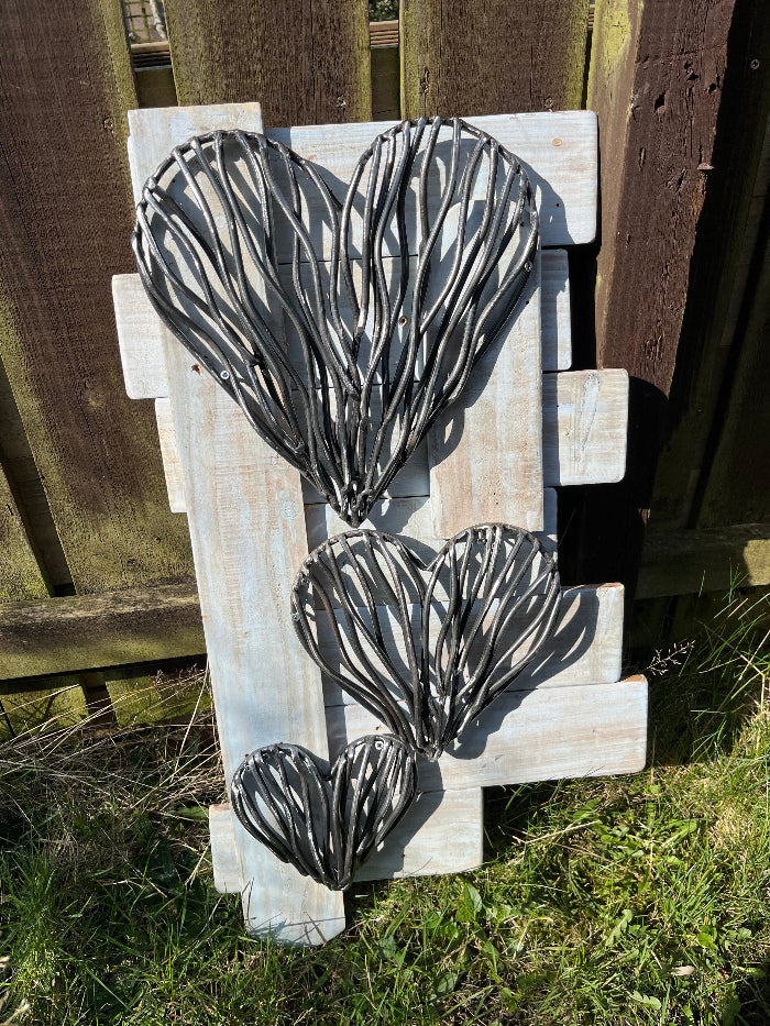 Trio of driftwood hearts