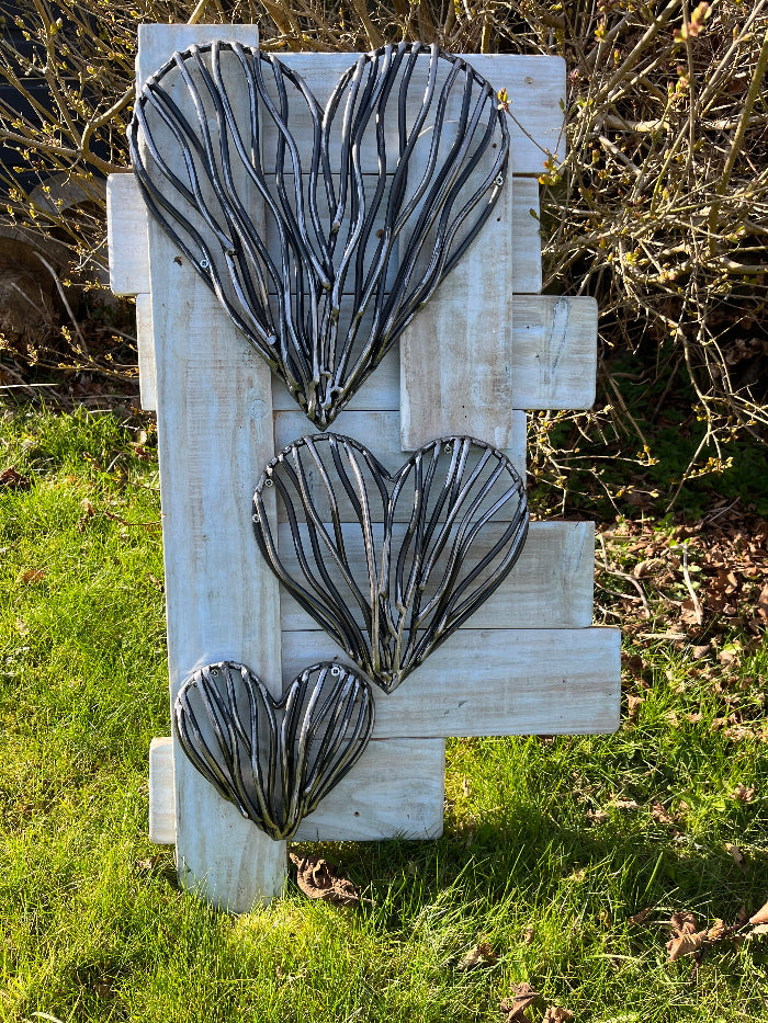 Trio of driftwood hearts